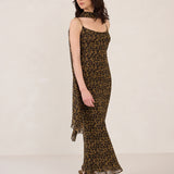 Woman wearing a leopard print dress on a white background